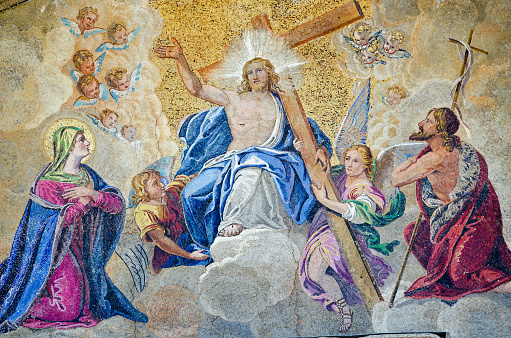 Mosaic showing the Last Judgement on the exterior of St Mark's Cathedral in Venice, Italy.  Historic mosaic, viewed on facade from public pavement.