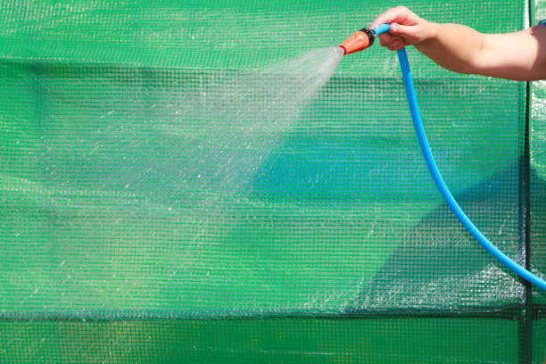 istock Working watering garden from hose 826613682