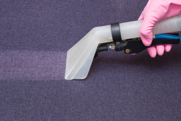 istock Sofa chemical cleaning with professionally extraction method. Hand in rubber protective glove holding nozzle of extractor. Upholstered furniture. Early spring or regular clean up. 826617656