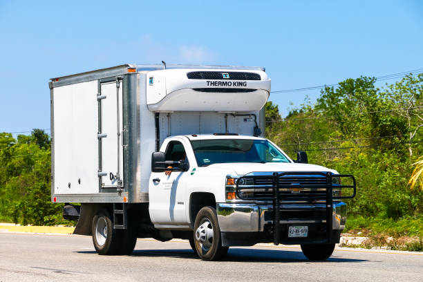 Chevrolet Silverado QUINTANA ROO - MAY 16, 2017: Refrigerator truck Chevrolet Silverado at the interurban road. car transporter truck small car stock pictures, royalty-free photos & images