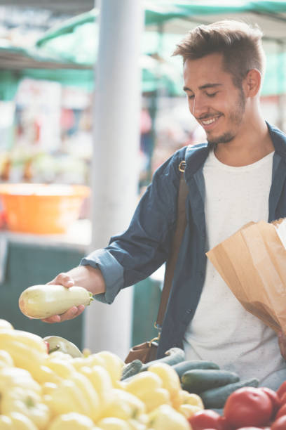 istock Young man shopping vegetables 826621346