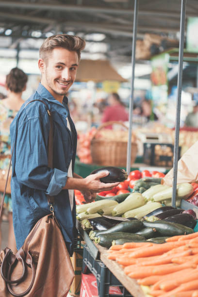 istock Smiling man on farmer's market 826621374