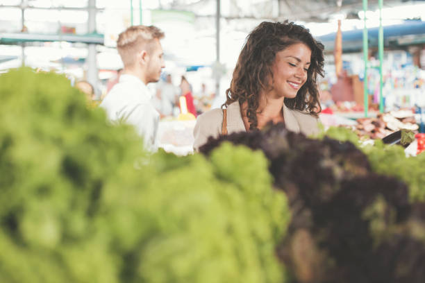 istock Young woman on market 826621654