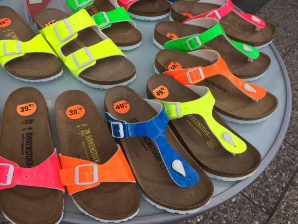 Berlin, Germany - July 31, 2017: Birkenstock sandals displayed in shoe store. The company is a famous German brand of sandals and other shoes notable for their contoured cork and rubber footbeds