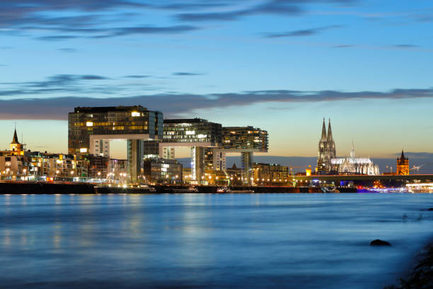 istock Cologne Cathedral and Crane Buildings at night 826622554