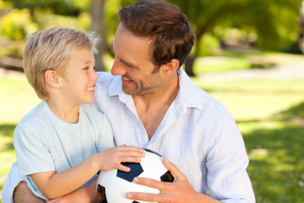 istock Father with his son after a football game 826626056