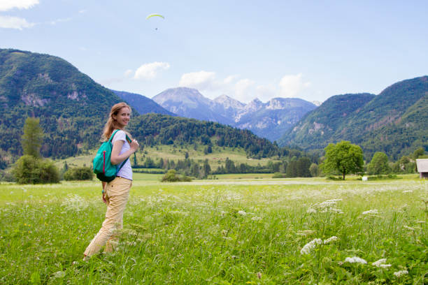 istock The beautiful woman walking on the Alpine meadows 826626366