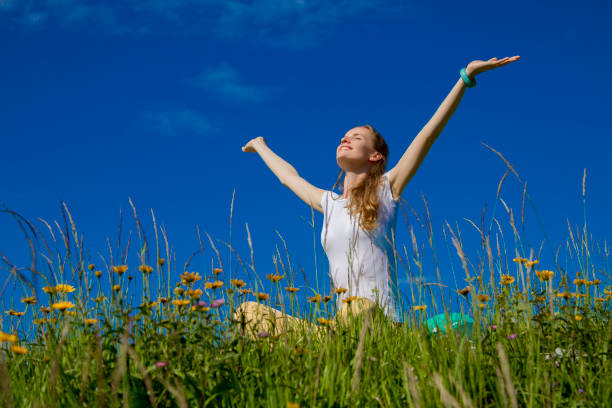istock The beautiful woman sitting on a grass 826626400