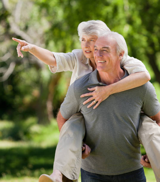 istock Man giving wife a piggyback 826627444