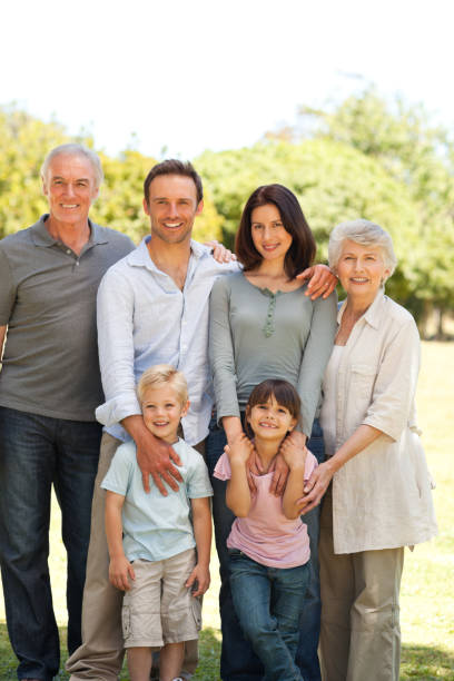istock Family standing in the park 826627494