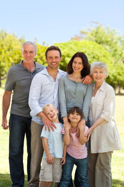 istock Family standing in the park 826629534