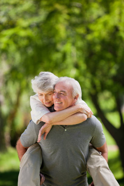 istock Man giving wife a piggyback 826630492