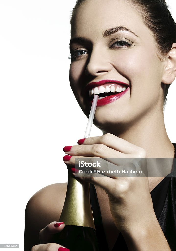 Woman sipping champagne through a straw  Drinking Stock Photo