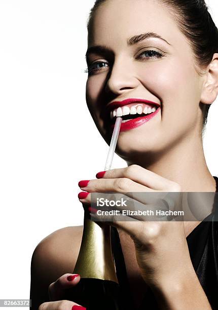 Woman Sipping Champagne Through A Straw Stock Photo - Download Image Now - Drinking, Party - Social Event, Champagne