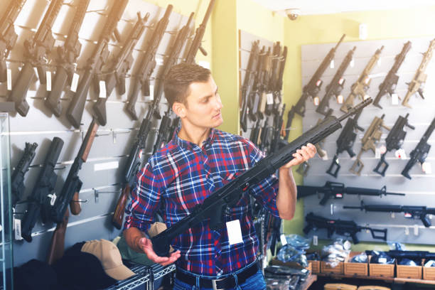 istock Man buying air weapon 826634520