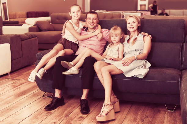 istock Family posing near new sofa 826634586