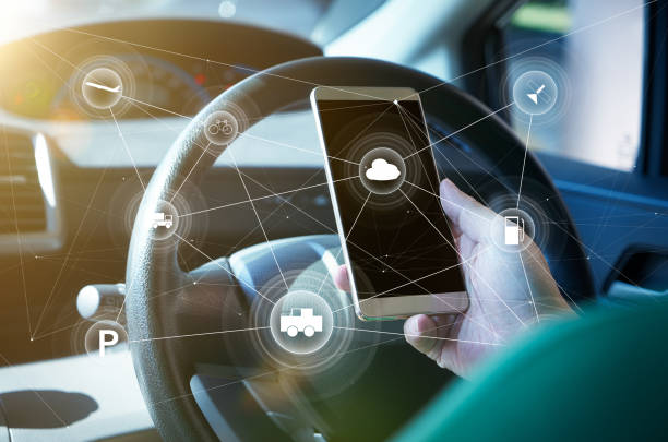 istock Man driver using smart self-driving car  control system on a hand phone. Futuristic driving technology concept . 826634782
