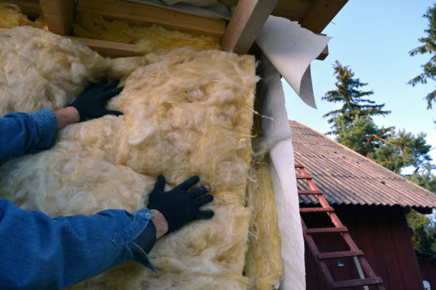 istock worker hands insulating with rock wool wooden house wall 826641818