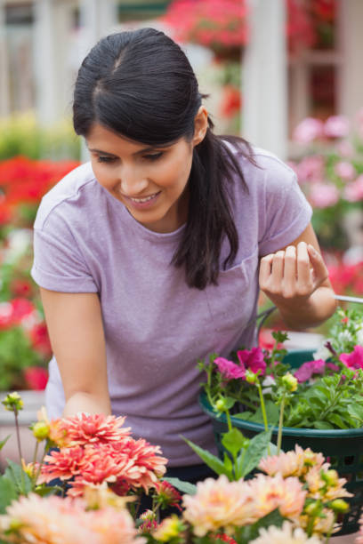 istock Woman shopping for plants 826642268