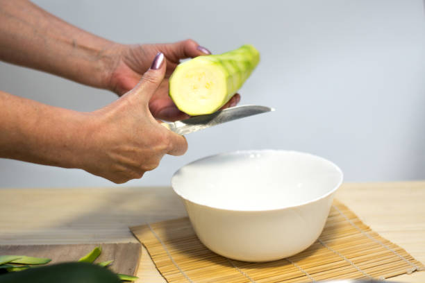istock Cutting of Zucchini for cooking 826645562