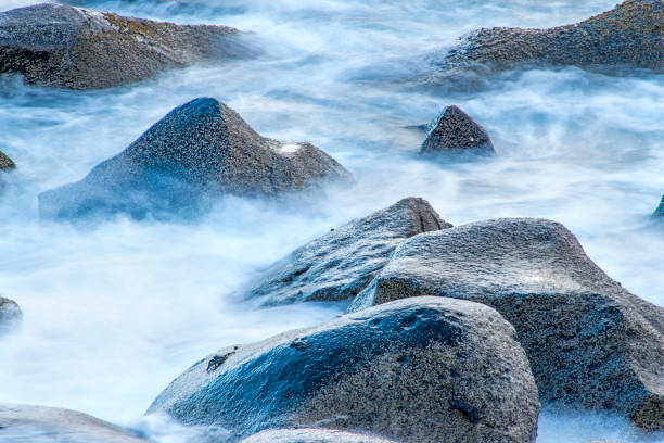 istock surf of the atlantic ocean with crabs in long time exposure 826648850