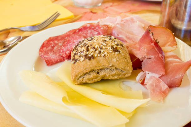 istock Salami sausages and bread with seeds at breakfast 826652996