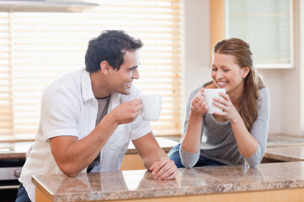 istock Couple having some coffee in the kitchen 826661560