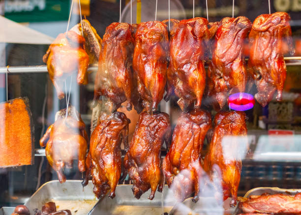 istock Roast ducks on display at a Chinese restaurant in London Chinatown 826661782