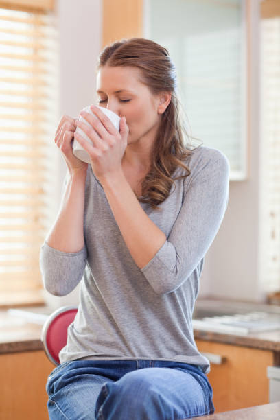 istock Woman relaxing with coffee in the kitchen 826664882