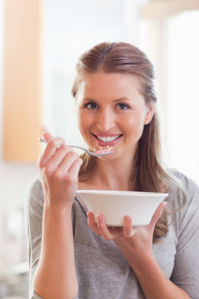 istock Woman eating cereals 826667926