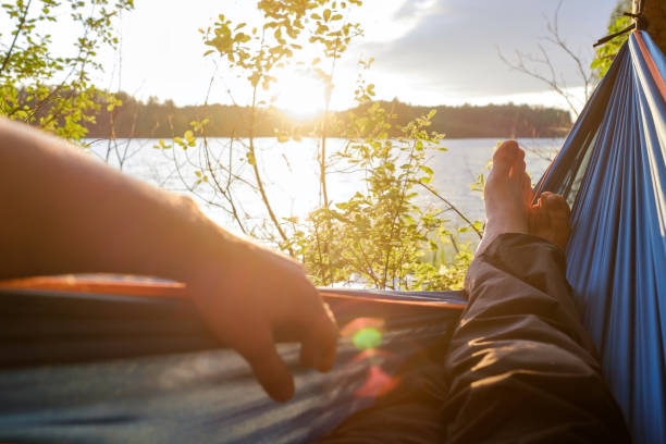 istock Man relaxing in the hammock. 826668276