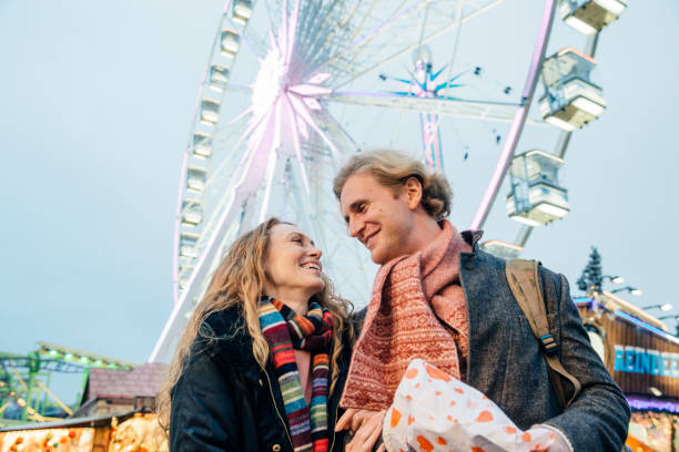 istock Happy Couple At Christmas Fair 826668532