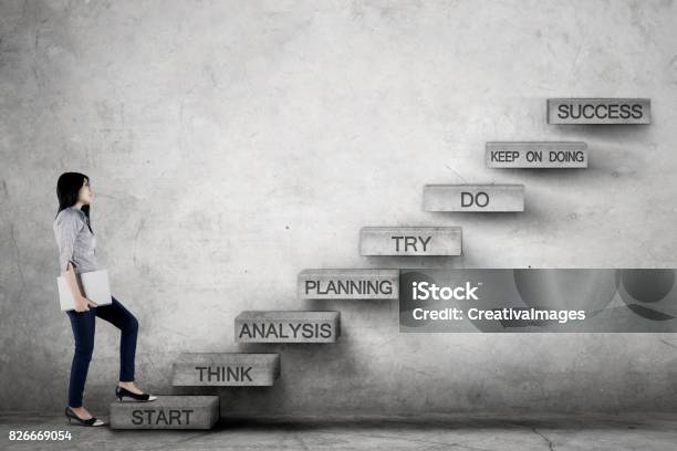 Businesswoman With Laptop Going Upstairs Stock Photo - Download Image Now - Success, Climbing, Staircase