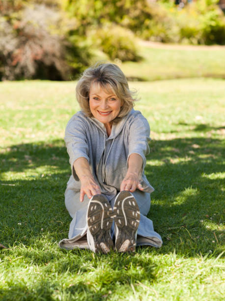 istock Senior woman doing her streches in the park 826672930