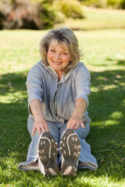 istock Senior woman doing her streches in the park 826673016