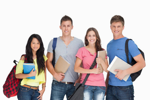 istock Students looking at the camera as they hold notepads 826673350