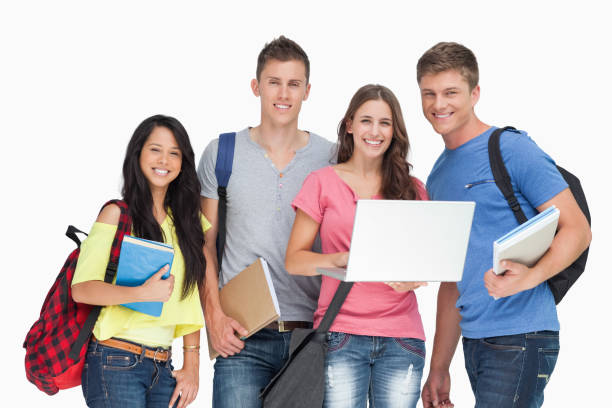 istock A smiling group of students holding a laptop while looking at the camera 826673526