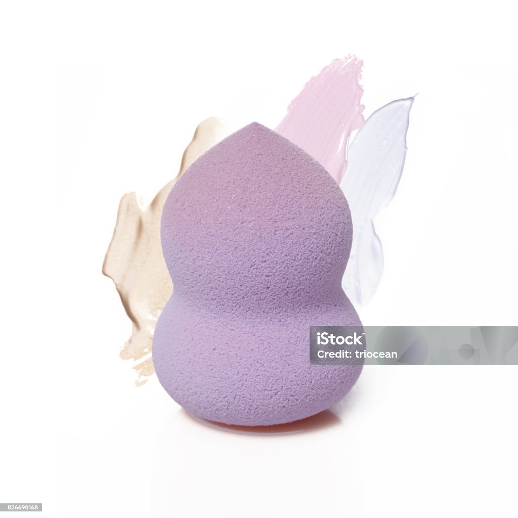 Cosmetic sponge with makeup samples Cosmetic sponge with makeup samples isolated on white Make-Up Stock Photo