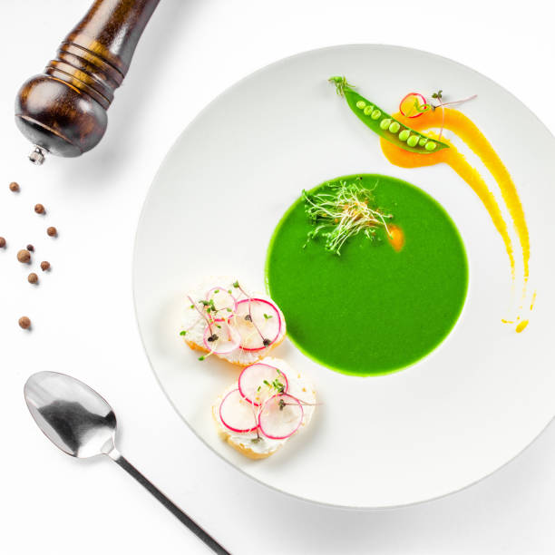 istock Pea cream soup in a rim soup plate 826690506