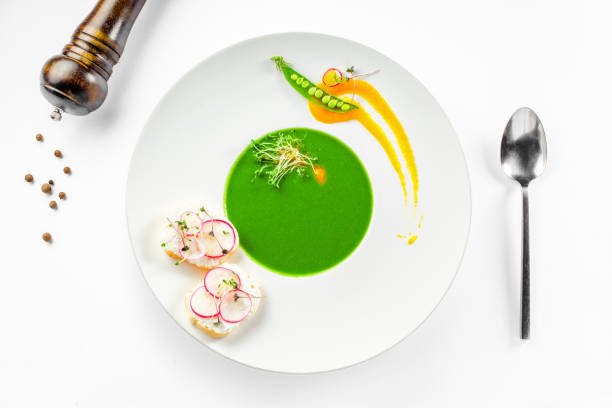 istock Pea cream soup in a rim soup plate 826690832