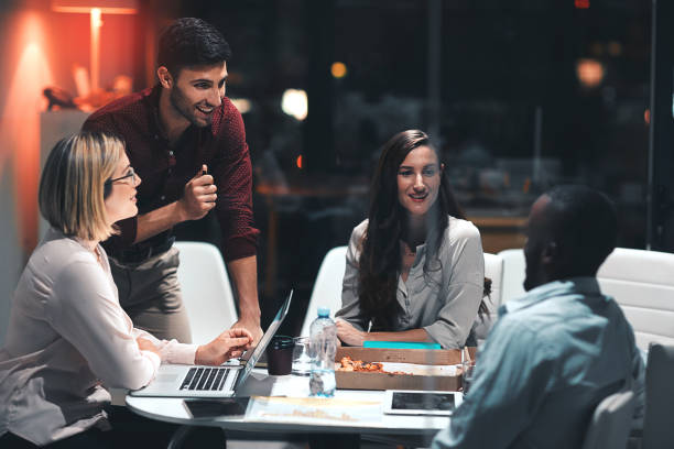 istock Getting the team together for a late night brainstorming session 826690884