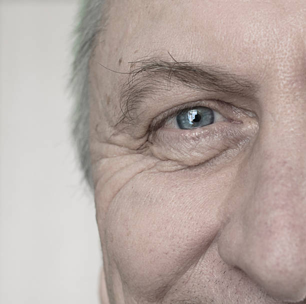 istock Closeup of Elderly Mans Blue Eye 826691222