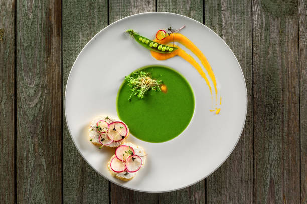 istock Pea cream soup in rim soup plate 826691332