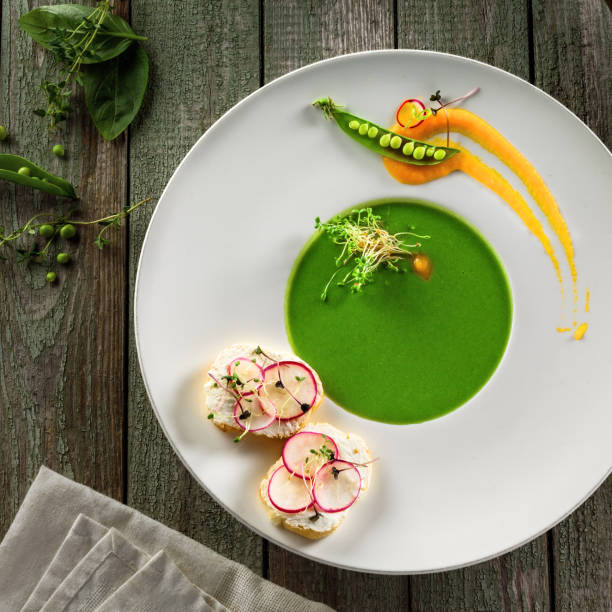 istock Pea cream soup in rim soup plate 826691482