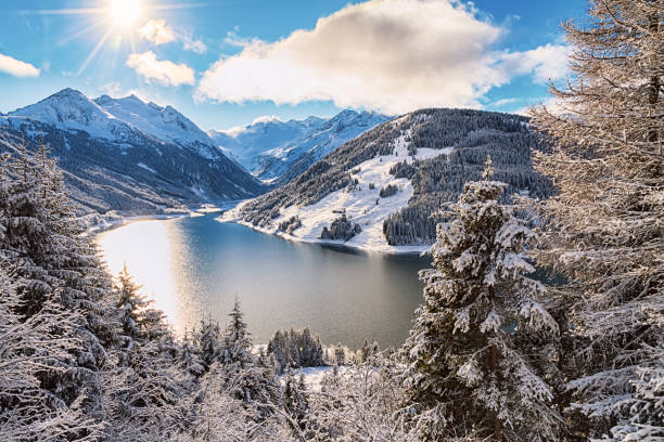 istock Winter landscape with lake and mountains 826691544