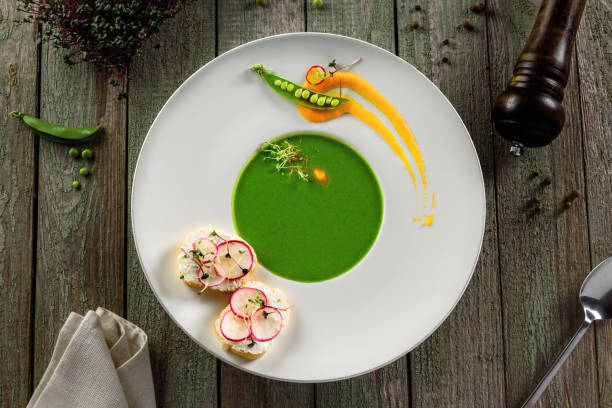istock Pea cream soup in rim soup plate 826691772