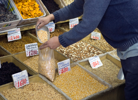 Nuts, peanuts, pistachios seeds dry nuts displayed in local market fresh air