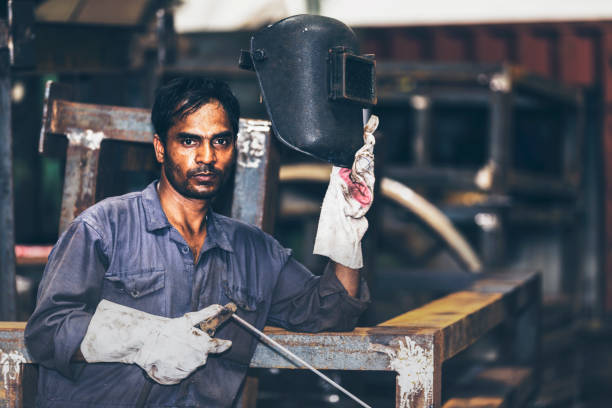 istock Welder slowly removing his mask after work 826692240