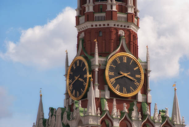 istock Kremlin clock chimes close-up against a blue cloudy sky. Moscow 826700156
