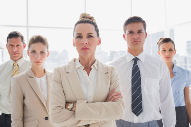 istock Group of serious business team standing together 826704784